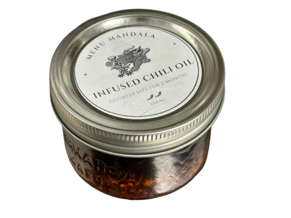 Wide mouth jar of chili crisp, 250 mL. Counter safe for two months.