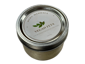 Sealed jar of vegan feta that crumbles after pulling with a fork