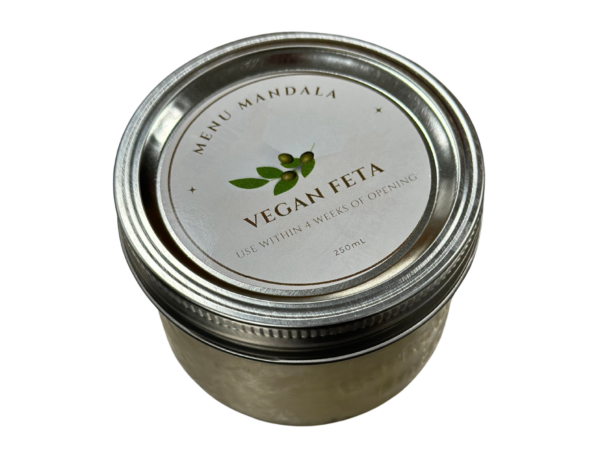 Sealed jar of vegan feta that crumbles after pulling with a fork